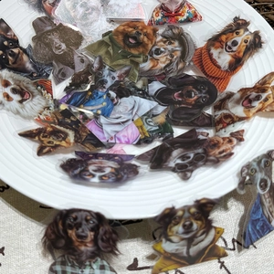 Close-up of waterproof cartoon dog stickers with anthropomorphic designs on a ceramic tray