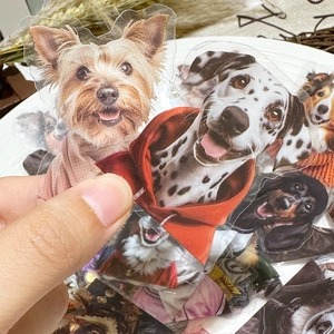 Detailed close-up of transparent dog stickers featuring various breeds on white background