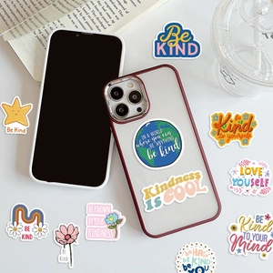 Detailed view of Be Kind waterproof motivational stickers applied on a modern phone case