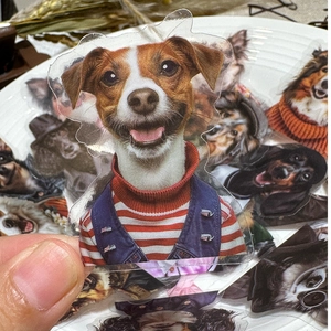 Close-up of waterproof cartoon dog stickers featuring Jack Russell and Schnauzer breeds