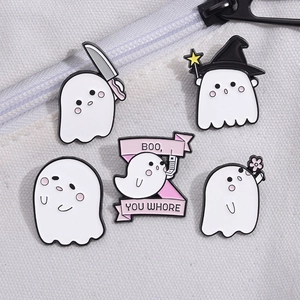 Set of 5 cute white ghost enamel pins with Boo You Whore text on a white canvas bag