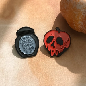 Halloween enamel pin set with Deadly Nightshade potion bottle and poison apple designs