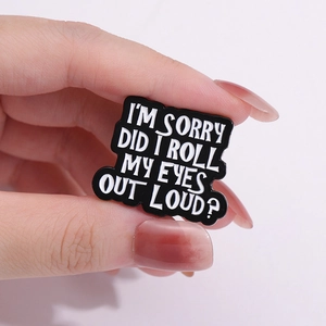 Funny enamel pin badge saying I'M SORRY DID I ROLL MY EYES OUT LOUD held in hand