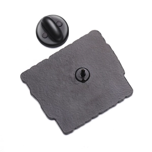 Detail of creative enamel pin back with durable metal needle and black rubber clutch