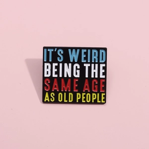 Creative enamel pin with 'It’s weird being the same age as old people' text design