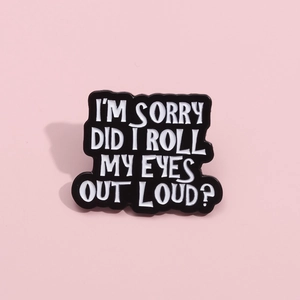 Black enamel pin with white text 'I'm Sorry Did I Roll My Eyes Out Loud' on pink background