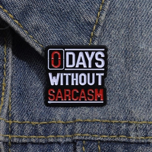 Funny 0 Days Without Sarcasm enamel pin on a denim jacket collar as stylish accessory