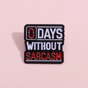 Funny 0 Days Without Sarcasm enamel pin badge in black metal with white and red lettering