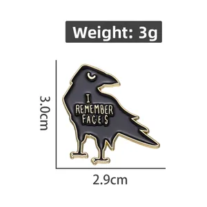 Cartoon black crow enamel pin with I REMEMBER FACES text in 3.0cm x 2.9cm size