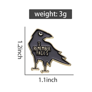 Detailed view of black crow enamel pin with I REMEMBER FACES text and size measurements