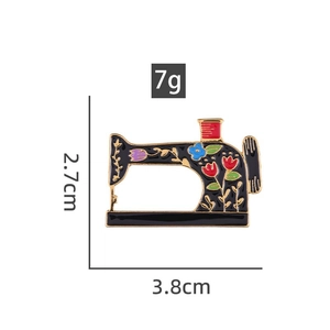 Detail of vintage sewing machine enamel pin with floral patterns and 3.8cm size specs
