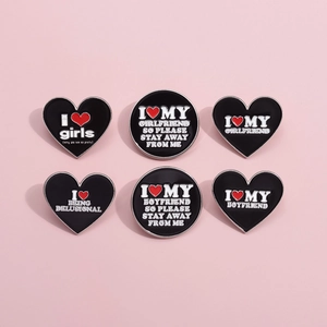 6-piece black heart enamel pins set with romantic quotes on a pink background