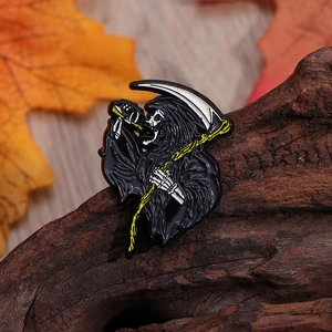Gothic Grim Reaper enamel pin with scythe and wine glass on autumn leaves background