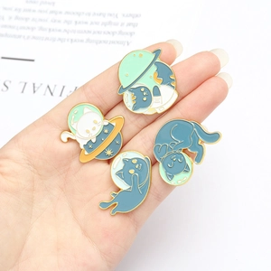 Set of four space-themed cat enamel pins with blue astronaut cat and planet motifs
