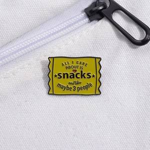 Creative yellow enamel snack lover brooch with funny text on a white canvas background