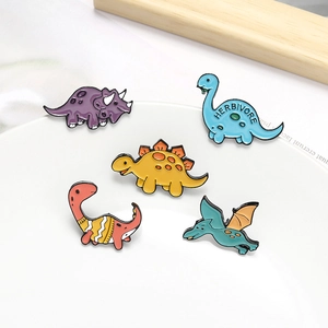 Set of five cute cartoon enamel dinosaur pins featuring colorful herbivore designs