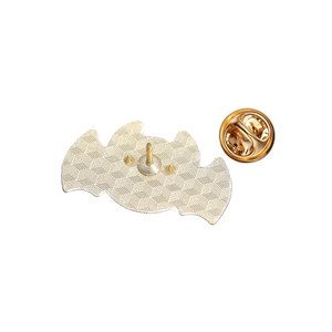 Macro detail of bat-shaped gold metal brooch back with secure butterfly clutch and pins