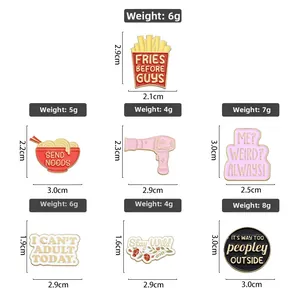 Detail view of cartoon enamel pins showing exact weights and sizes for each design