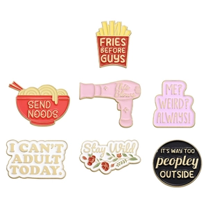 Set of 7 colorful enamel pins featuring fun text, fries, ramen, and a hair dryer