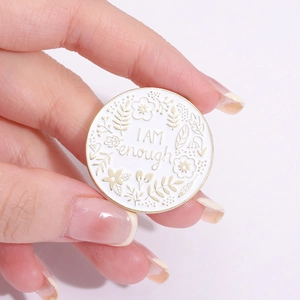 Minimalist round enamel brooch with golden rim and I AM enough floral engraving