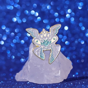 Fantasy enamel wing brooch with heart and star motifs in gold finish and blue tones