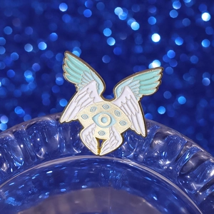 Exquisite white angel eye enamel brooch with golden wings on blue water ripple base