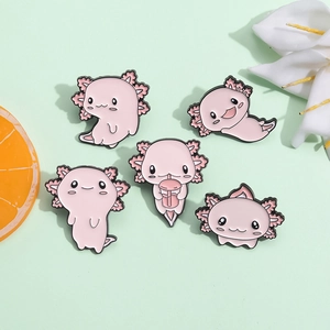 Set of five cute pink axolotl enamel pins in cartoon style on a fresh green background