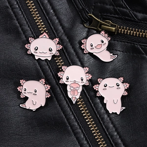 Detail of five pink axolotl enamel pins styled on a black leather jacket lapel
