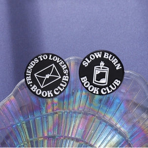 Punk enamel book club pins with slow burn and friends to lovers text on tray