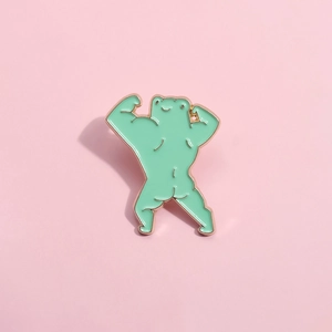 Funny cartoon muscular frog enamel pin with green finish and gold metal outline