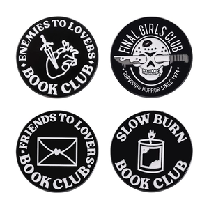Set of four black and white enamel pins with literary and horror book club themes