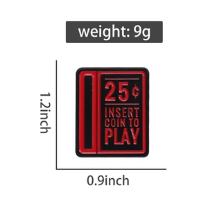 Detailed view of red retro arcade coin slot enamel pin with 25 cent insert coin text