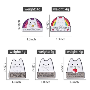 Cute white cat enamel pins with rainbow and star motifs and funny lettered quotes