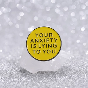 Pin's en émail santé mentale Your Anxiety Is Lying To You sur cristal blanc