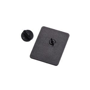 Rear detail of matte black enamel pin showing metal needle and rubber clutch closure