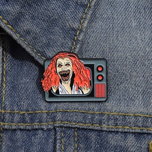 Scary girl crawling out of TV enamel pin, creative horror theme metal badge for clothes