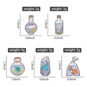 Detailed view of ocean animal enamel pins in glass jars with size and weight specs
