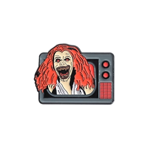 Creepy red-haired horror character crawling out of vintage TV enamel brooch pin