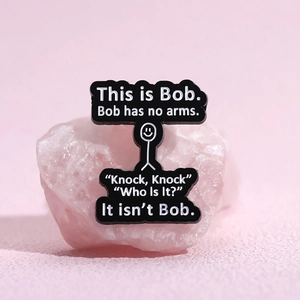 Funny This is Bob stick figure enamel pin on pink mineral stone background