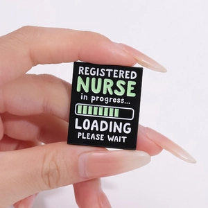 Close-up of enamel pin showing 'Registered Nurse in progress' with a loading bar