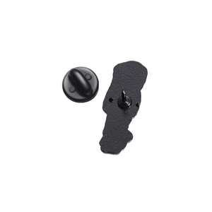 Detailed macro view of matte black metal brooch backing and secure clutch pin fastener