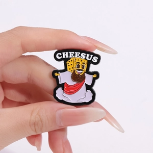 Funny Cheesus cartoon enamel pin accessory with yellow cheese character on light background