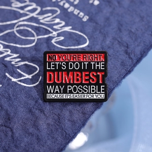 Funny enamel pin with red geometric design and witty English quote on blue textured background