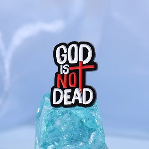 God Is Not Dead enamel pin with red cross detail on light blue crystal display