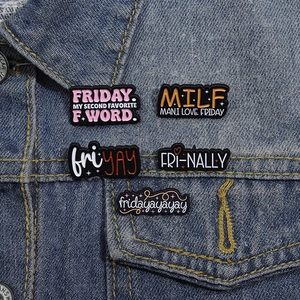 Five unique Friday themed enamel pins displayed on a blue denim jacket for a creative look