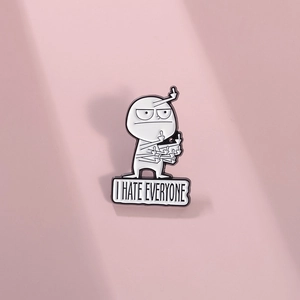 Minimalist black and white enamel pin with cartoon figure and I Hate Everyone slogan