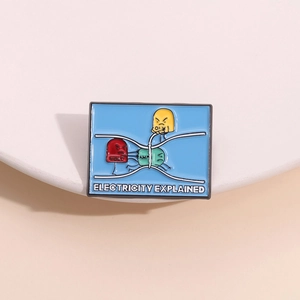 Close-up of enamel pin illustrating Volt Amp and Ohm physics electricity concepts