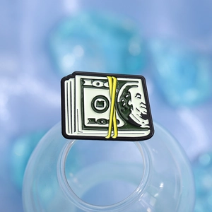 Creative stack of cash money shoe charm with green bill design and yellow rubber band