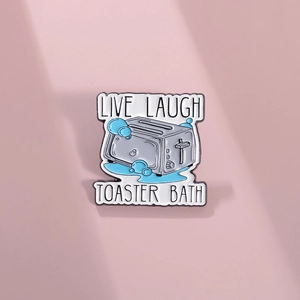 Creative toaster bath enamel pin with Live Laugh text on minimalist pink background