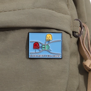 Creative Ohm's Law enamel pin on canvas bag explaining electricity with cartoon icons